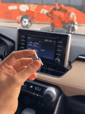Wireless Car Play Adapter by My Store, showing a car dashboard with the device connected to a smartphone for seamless integration.
